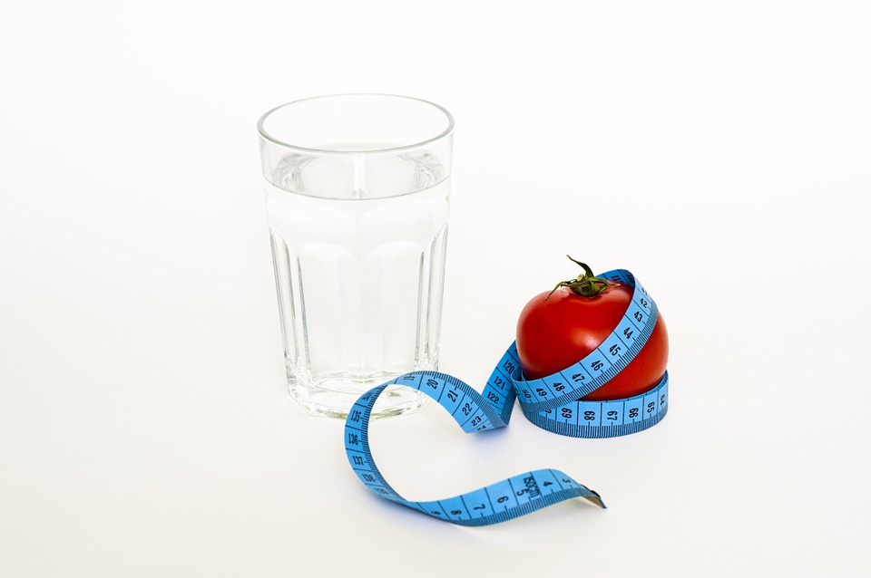 Water glass and apple
